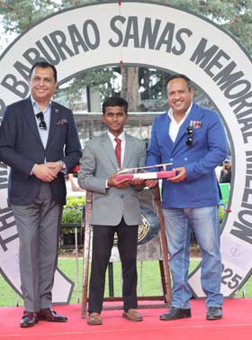 Leading apprentice jockey Aditya Waydande receiving the trophy from RWITC Steward Jiyaji Bhonsle at Pune on Sunday.