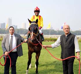 Trainer Bahram Cama and Jaydev Mody leading in Harrison (Adiya Waydande up), winner of Aristos Plate at Mumbai on Thursday.