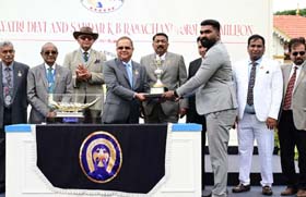 Chaduranga Kantharaj Urs presenting the Smt Gayatri Devi and Sardar K B Ramachandraraj Urs  Million Trophy to trainer Aditya whose ward Gold Kite won this event at Mysore on Sunday.