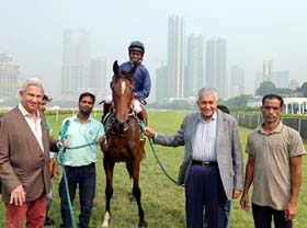 Shyam Ruia and trainer Imtiaz Sait leading in Ekatarina (Neeraj Rawal up), winner of Aslam Kader Salver at Mumbai on Sunday.