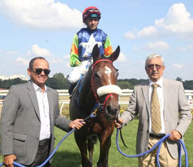 Trainer M K Jadhav (right) leading in Miss American Pie (N S Parmar up), winner of Noshir & Dolly Dhunjibhoy Sprint Million at Pune on Sunday.