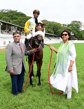 Maana (Trevor Patel up) winner of the ROYAL WESTERN INDIA TURF CLUB MILLION, being led in by trainer Darius R Byramji on Sunday races at Mysore.