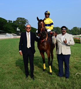 Trainer Irfan Ghatala and joint owner J Ramesh leading in Mandarino, winner of Cubic Mysore Derby at Mysore on Sunday.