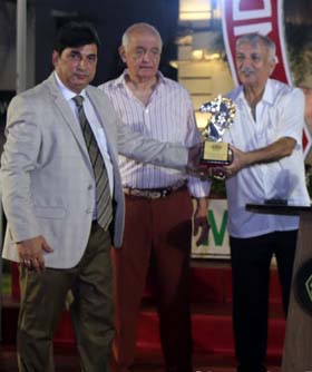 Pesi Shroff receiving the Champion Trainer trophy from RWITC Chairman Surendra Sanas at the conclusion of the Mumbai Racing Season on Sunday. In the middle is Khushroo Dhunjibhoy whose Five Stars Shipping  Company was thee leading owner of the season.
