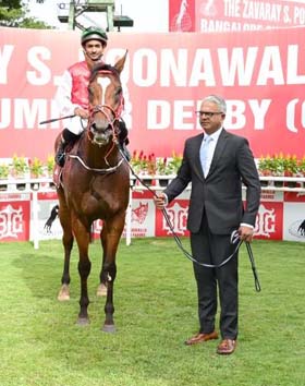 Positano (Akshay Kumar up), winner of Gr 2 Maharaja`s Cup being led in by trainer Sulaiman Attaollahi at Bangalore on Sunday.