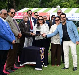 B Vijay presenting the  Sarvang Stud And Agricultural Farm Trophy to the winning connections of Renoir which won this event at Mysore on Thursday.