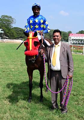 Seductive (Antony Raj S up), winner of the SEA MIST PLATE (DIV-II), being led in by trainer Rakesh on Thursday races at Mysore.