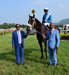 Trainer Satish Narredu and M Ravi leading in Shamrock (Suraj Narredu up), winner of Mysore Race Club Anniversary Cup at Mysore on Sunday.