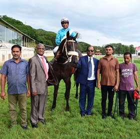 Shamrock (Suraj Narredu up) winner of the MAHARAJA`S CUP - 2026 (GR.2), being led in by trainer S Narredu on Friday races at Mysore.