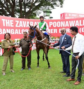 Sharmila Padmanabhan and trainer Padmanabhan leading in Miracle Star (Trevor Patel up), winner of Fire Haven Plate at Bangalore on Saturday.