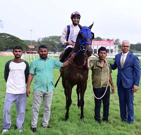 Sicyon (Shreyas Singh up) winner of the URS KAR TROPHY, being led in by trainer S S Attaollahi on Friday races at Mysore.