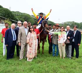 Zuccaro (Vivek G up) winner of the ZAVARAY POONAWALLA INDIAN TURF INVITATION CUP (GR.I), being led in by trainer P Shroff on Sunday races at Mysore.