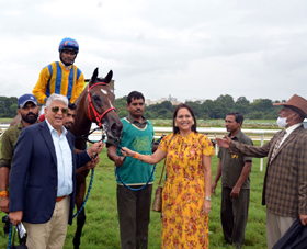 Geoffrey Nagpal and trainer Sunderji (in hat) leading in Kaitlan (A Sandesh up), winner of Royal Barbers Trophy (Div II) at Pune on Monday. 