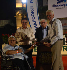 P  J Vazifdar presenting the J P Vazifdar Trophy to Mukul Sonawala and Saleem Fazelboy, joint owners of It’s My Time which won the race in Mumbai on Sunday.